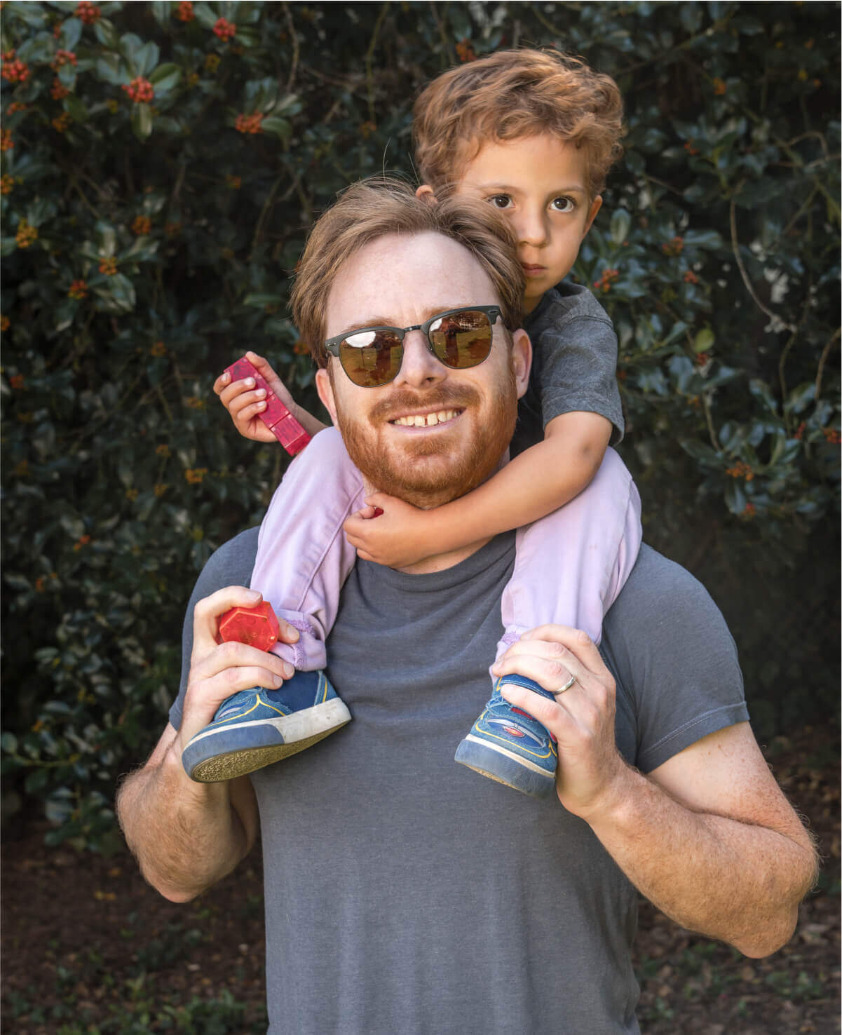 Dad carrying son on shoulder 2